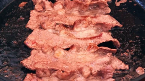 Beef bacon frying in UHD Stock-Footage 152377932