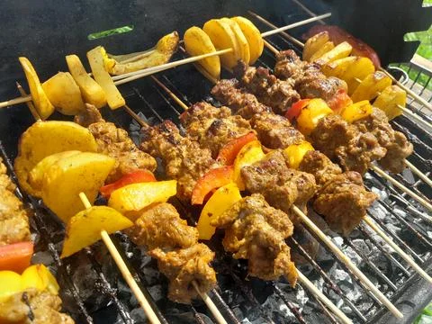 Beef barbeque on heating for grilling Stock Photos