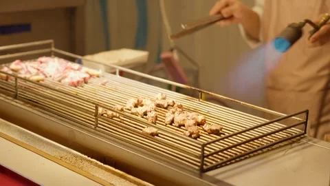 Beef BBQ is cooked and served at night street market, Taipei, Taiwan - 4k Stock Footage 295516241