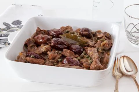 Beef with beer and dates Stock Photos