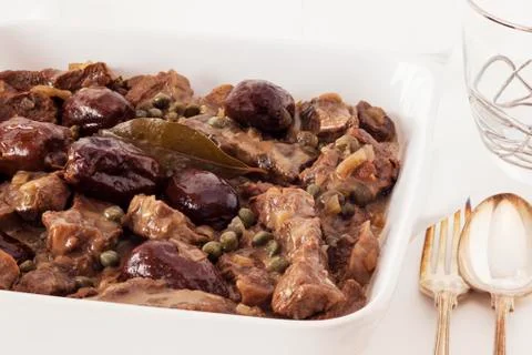 Beef with beer and dates Stock Photos