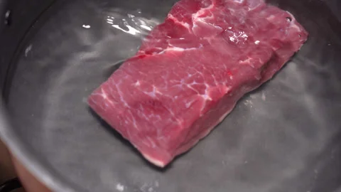 Beef boiled in a saucepan. High quality 4k footage Stock Footage 255600290
