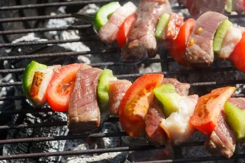 Beef brochettes on barbecue Stock Photos