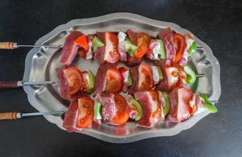 Beef brochettes on a dish Stock Photos