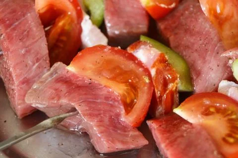 Beef brochettes on a dish Stock Photos