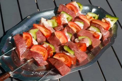 Beef brochettes on a dish Stock Photos