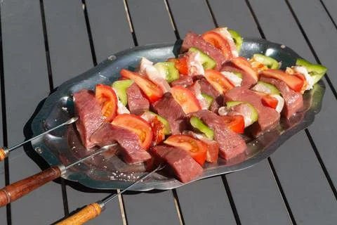 Beef brochettes on a dish Stock Photos