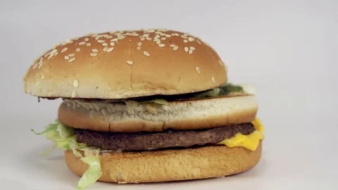 Beef burger falling on white background Stock Footage 72622683