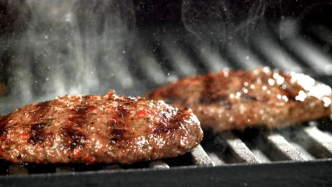 Beef burger is fried in a grill pan. Filmed on a high-speed camera at 1000 fps. Stock Footage 309221430