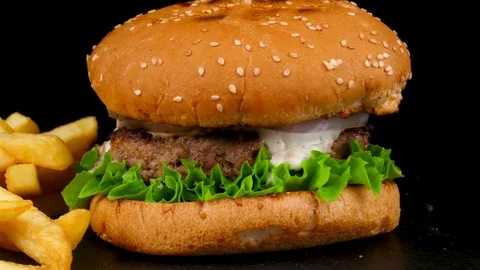 Beef burger with pickled cucumbers and Fried Potato wedges Stock Footage 84652143