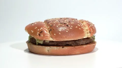 Beef Burger rotating on the table on a w... | Stock Video | Pond5