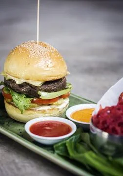 Beef burger set with lotus chips and sauces Stock Photos