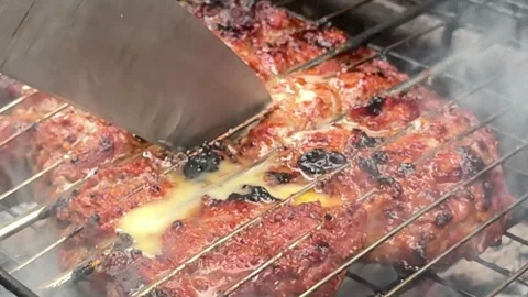 Beef with butter barbecue party, close-up footage of grilling steaks, spiking Stock Footage 317701628