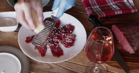 Beef carpaccio hard cheese grating 스톡 동영상 330406509