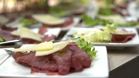 Beef carpaccio with parmesan cheese chip and salad, appetizer Stock Footage 196934214