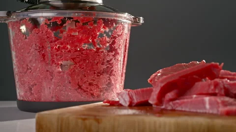Beef is chopped up in a blender to make ground beef Video stock 311673317