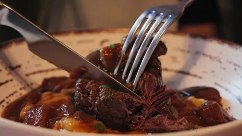 Beef chuck roast, a juicy and tender cut with mushrooms and with mashed potatoes Stock Footage 334837077