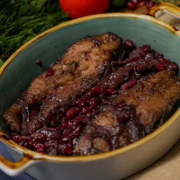 Beef cooked with beans and garnished at a dining table 库存照片