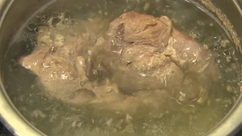 Beef is cooked in an open pan Stock Footage 105189938