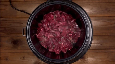 Beef cooked in a slow cooker is steam Stock Footage 129100941