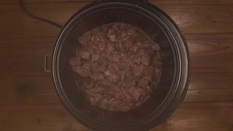 Beef cooked in a slow cooker is steam Stock Footage 129101035