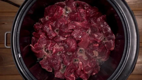 Beef cooked in a slow cooker is steam Stock Footage 129101046