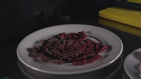 Beef cooking with fire at the dish Stock Footage 89232058