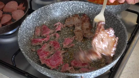 Beef cutlet cooked in a pan on the stove, breakfast preparation, breakfast pr Video stock 201268302