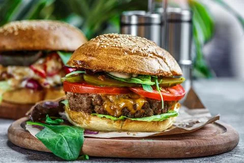 Beef Egg and Bacon Burger Served in Restaurant. American fastfood. Tasty Gour Stock Photos