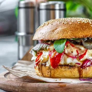 Beef Egg and Bacon Burger Served in Restaurant. American fastfood. Tasty Gour Stock Photos