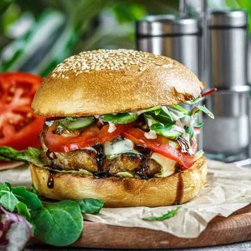 Beef Egg and Bacon Burger Served in Restaurant. American fastfood. Tasty Gour Stock Photos
