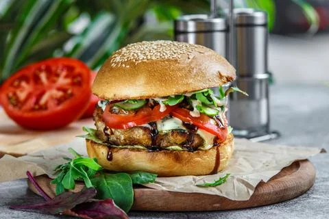 Beef Egg and Bacon Burger Served in Restaurant. American fastfood. Tasty Gour Stock Photos