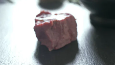 Beef fillet slices wrapped being secure with  twine Vídeo Stock 106924117