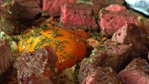 Beef fried rice topping with beef and pickled egg yolks. Stock Footage 310947016