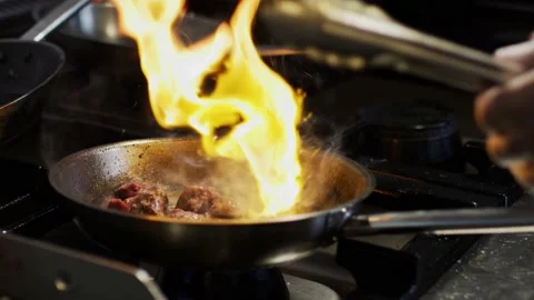 Beef getting cooked in fire slow motion 動画素材 130301350