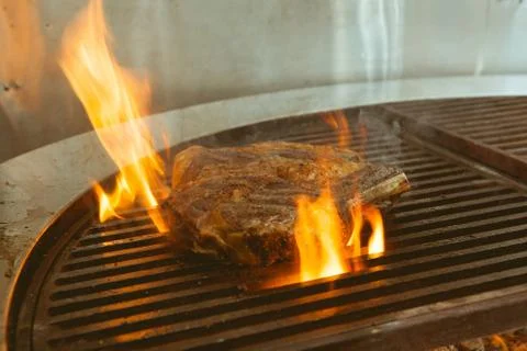 Beef grill on stove in five star hotel restaurant for luxury dinner party, Bl Stock Photos