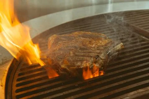 Beef grill on stove in five star hotel restaurant for luxury dinner party, Bl Stock Photos