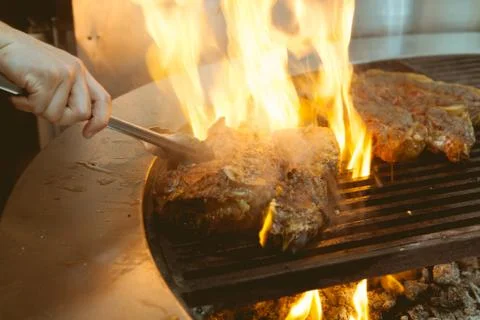 Beef grill on stove in five star hotel restaurant for luxury dinner party, Bl Stock Photos