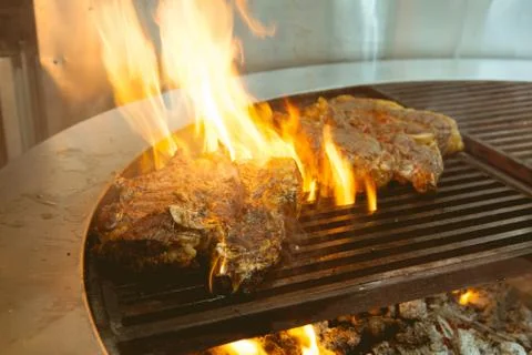 Beef grill on stove in five star hotel restaurant for luxury dinner party, Bl Stock Photos