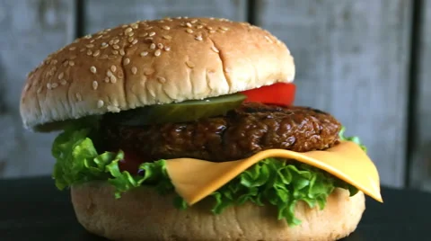 Beef hamburger grill  pickled cucumber tomato cheese Video stock 67750031