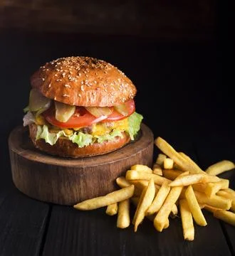 Beef hamburger ready be served with fries Stock Photos