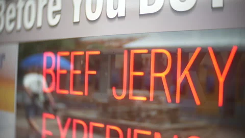 Beef Jerky Neon Sign Storefront Window Red Lettering Retail Food Display Vidéo 336038156