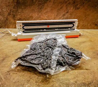 Beef jerky packed using vacuum packaging sealer Фото
