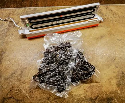 Beef jerky packed using vacuum packaging sealer Stockfoto's