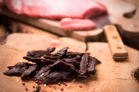 Beef Jerky on wooden background Stock Photos