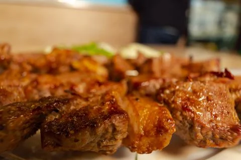 Beef kebab close up. BBQ beef steak with spices Stock Photos