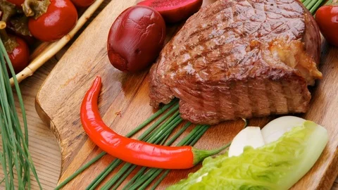 Beef ( lamb ) garnished with green lettuce and red pepper Video stock 88922823