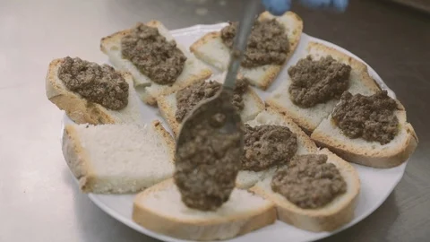Beef livers sauce on toasted bread Stock Footage 86391884
