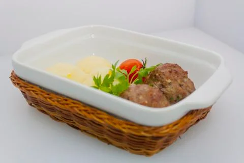 Beef meat balls with mashed potatoes and pickled tomatoes Stock Photos