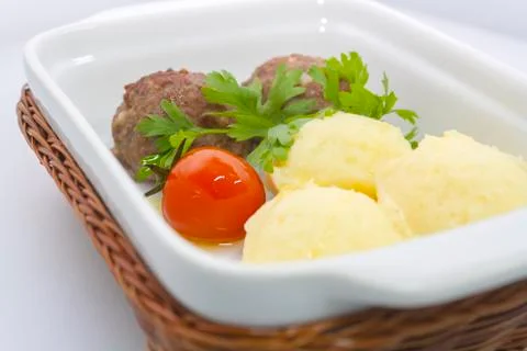 Beef meat balls with mashed potatoes and pickled tomatoes Stock Photos